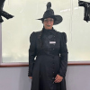 Library assistant Bernice, dressed up in a witch costume.