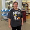 Library Director Sheila, in a Peanuts Halloween t-shirt featuring Snoopy