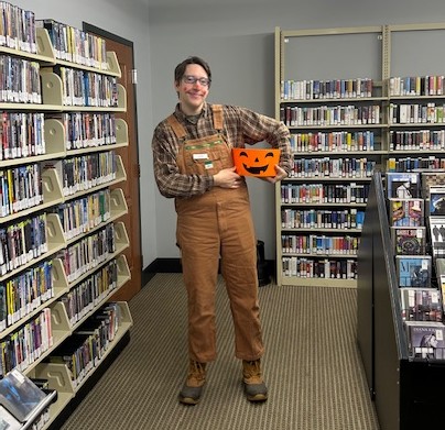 Adult Services Librarian Jacob, dressed up as a scarecrow