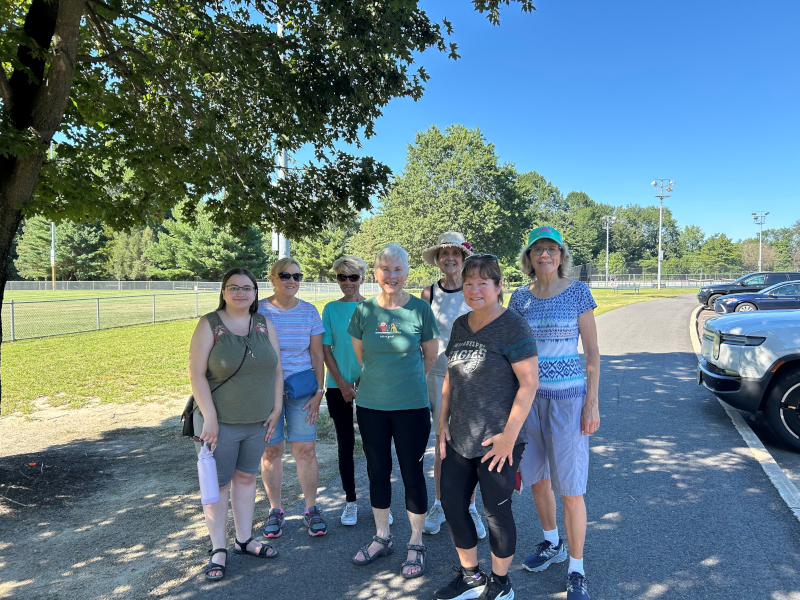 Seven members of the Rambling Readers book group pose for a photograph at Washington Lake Park