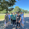 Seven members of the Rambling Readers book group pose for a photograph at Washington Lake Park